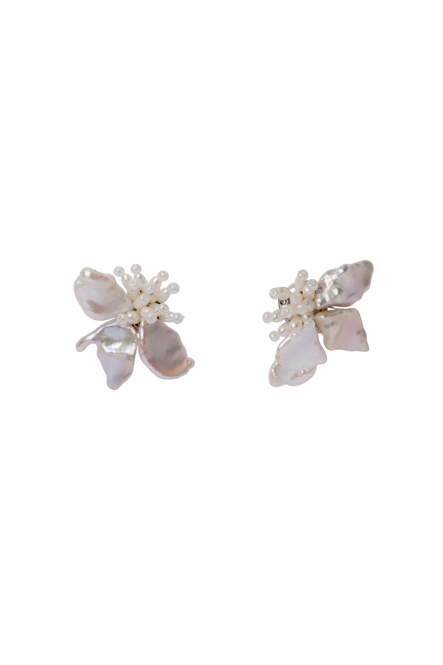 Pair of floral earrings with white and beige flowers on a white background