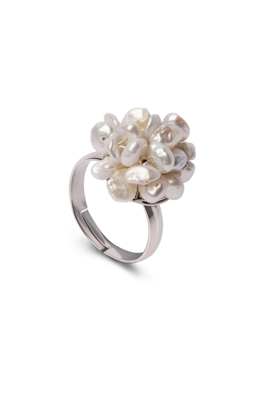 Silver ring with a cluster of pearls on a white background