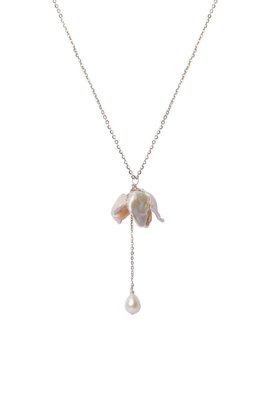 Necklace with a floral pendant and pearl drop on a white background