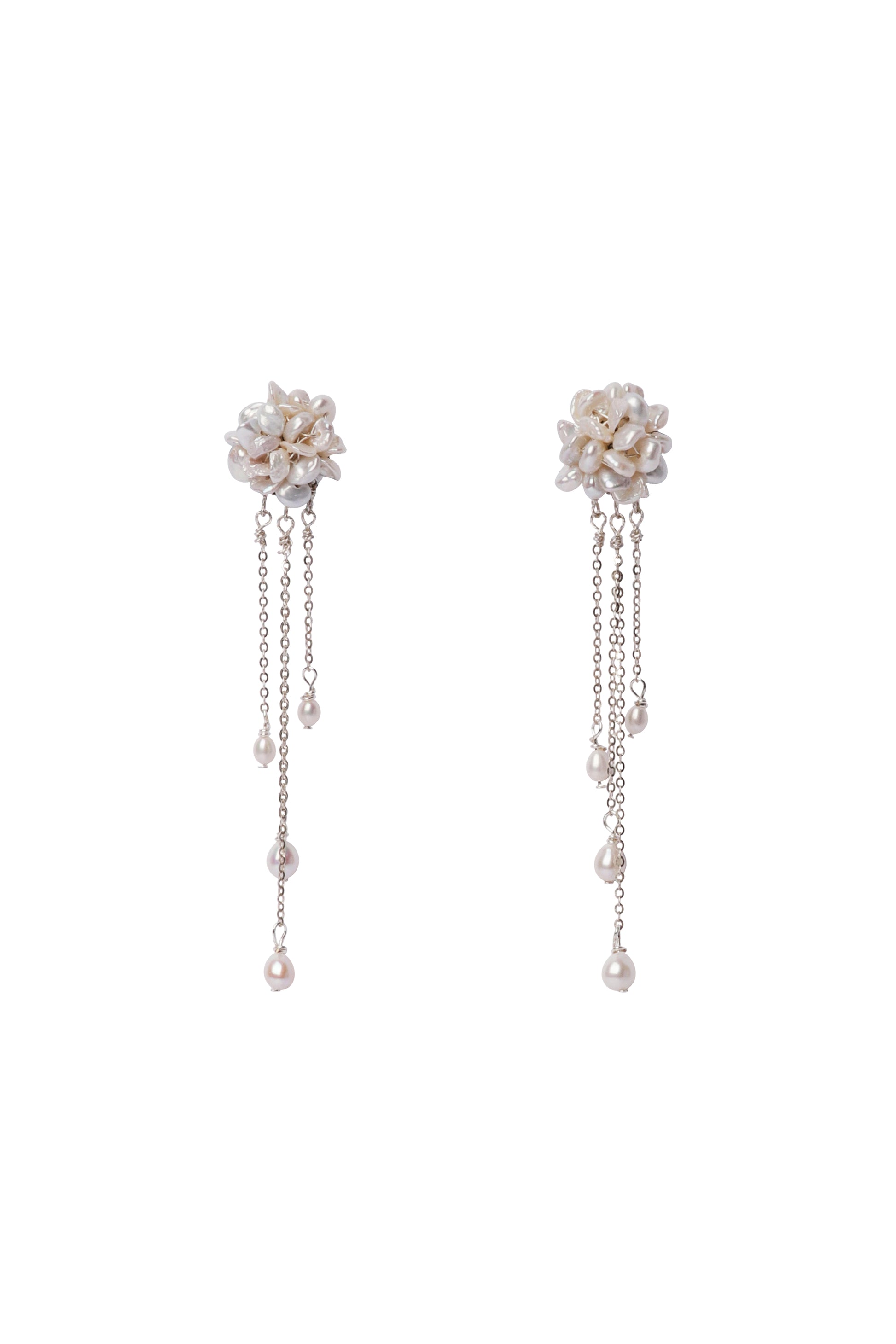 Pair of floral earrings with chain details on a white background